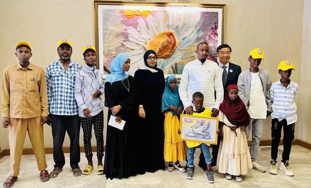 six-year-old Kawkib Mohamud and family with H.E. Ambassador Fei Shengchao during the award ceremony at the Chinese Embassy in Somalia. September 13, Mogadishu, Somalia.